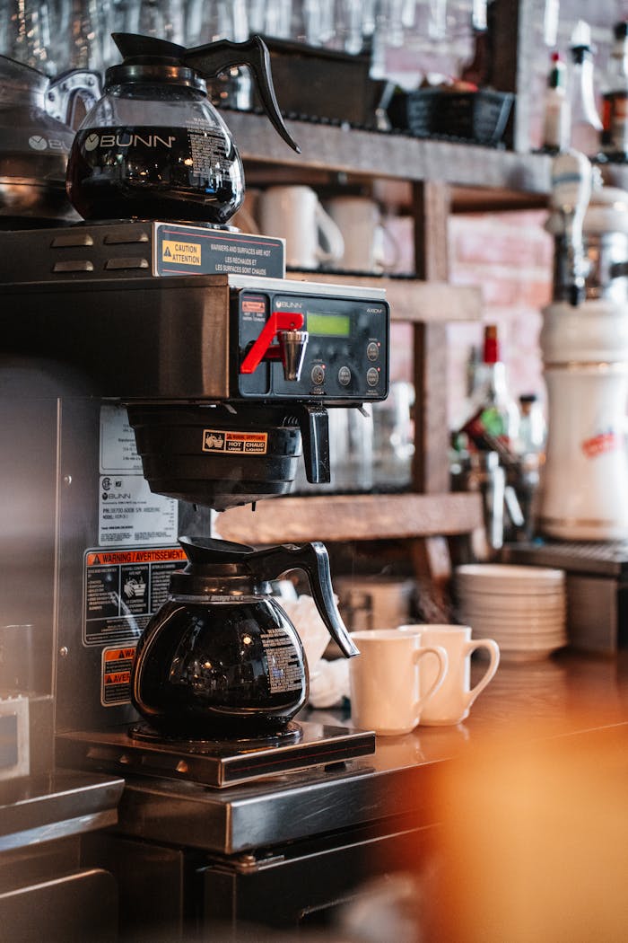 Professional coffee machine in a rustic Québec café, with cups ready, capturing the essence of cozy café culture.